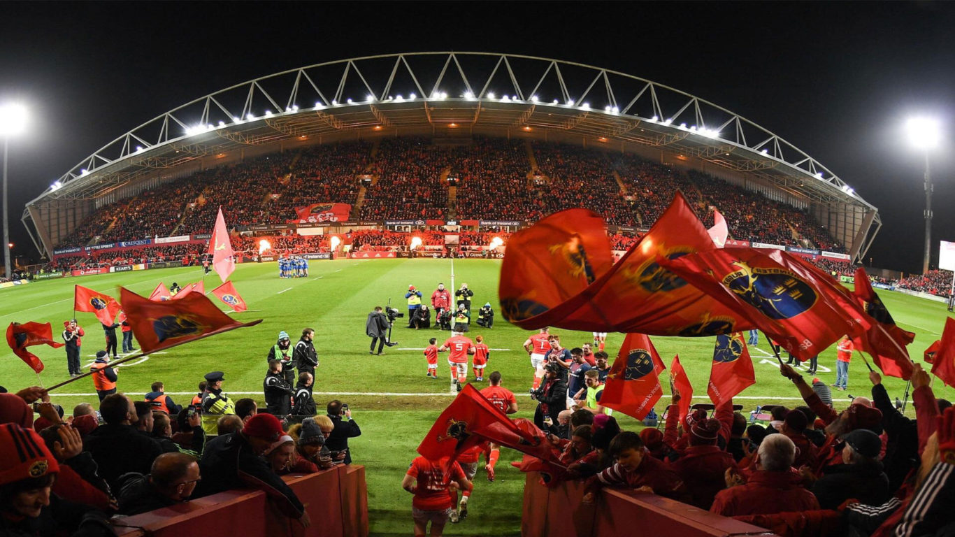 Image of Munster Rugby Supporters waving flags at Thomond Park. South Court Hotel is near Thomond Park, located only 10 minutes away from the stadium.